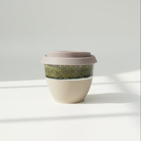 Black Forest Primo ceramic travel cup in deep forest green, 6oz, with silicone lid